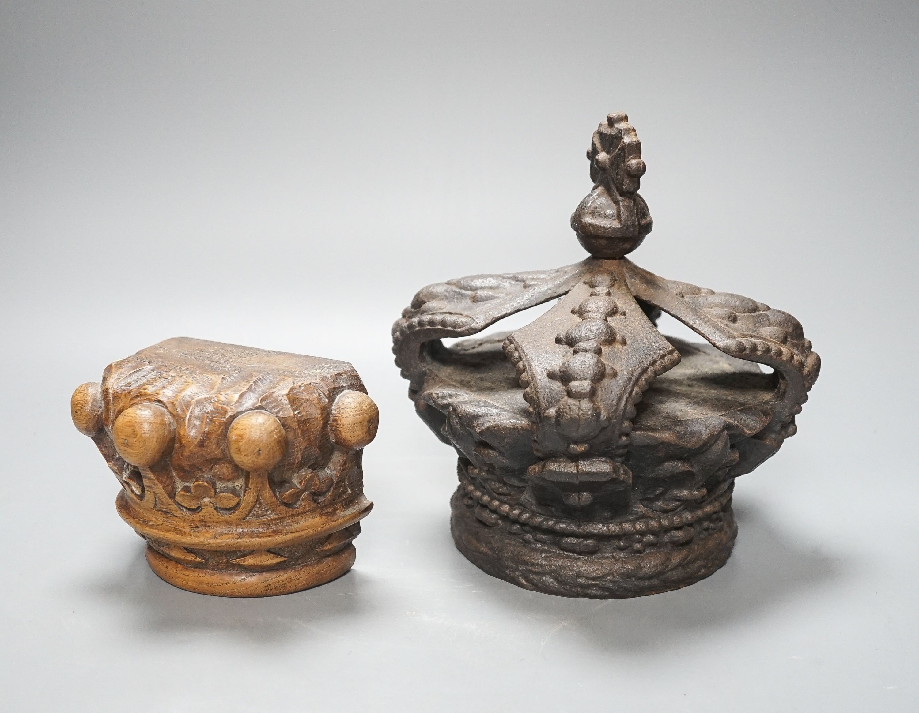 A Victorian cast iron model of a crown and a carved wood crown appliqué 21cm